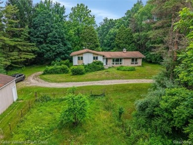 Step into this one-of-a-kind mid-century modern home tucked away on Kensington Metropark Golf Course in Michigan - for sale on GolfHomes.com, golf home, golf lot