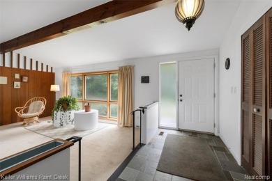 Step into this one-of-a-kind mid-century modern home tucked away on Kensington Metropark Golf Course in Michigan - for sale on GolfHomes.com, golf home, golf lot