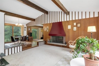 Step into this one-of-a-kind mid-century modern home tucked away on Kensington Metropark Golf Course in Michigan - for sale on GolfHomes.com, golf home, golf lot