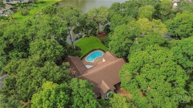 This beautifully updated home in The Landings offers privacy on The Landings Club - Palmetto in Georgia - for sale on GolfHomes.com, golf home, golf lot