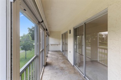Welcome to this charming and spacious 2nd-floor condo located in on Wynmoor Golf Course in Florida - for sale on GolfHomes.com, golf home, golf lot