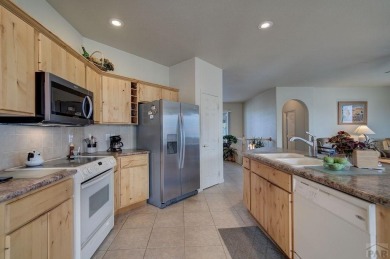 Right on golf course!  You'll LOVE the location and quality of on Desert Hawk At Pueblo West in Colorado - for sale on GolfHomes.com, golf home, golf lot