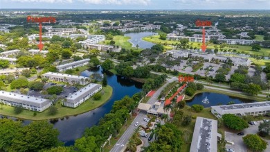 Welcome to this charming and spacious 2nd-floor condo located in on Wynmoor Golf Course in Florida - for sale on GolfHomes.com, golf home, golf lot