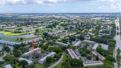 Welcome to this charming and spacious 2nd-floor condo located in on Wynmoor Golf Course in Florida - for sale on GolfHomes.com, golf home, golf lot