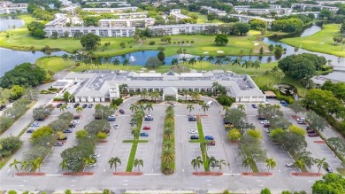 Welcome to this charming and spacious 2nd-floor condo located in on Wynmoor Golf Course in Florida - for sale on GolfHomes.com, golf home, golf lot