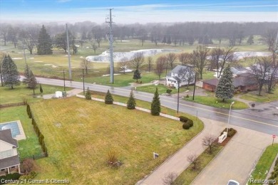 Approximately 1/2 acre, east facing lot, in a beautiful high end on Monroe Golf and Country Club in Michigan - for sale on GolfHomes.com, golf home, golf lot
