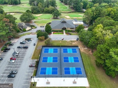 Welcome home to an oasis not too far from the city. Quiet 13 on Canongate At Flat Creek Club in Georgia - for sale on GolfHomes.com, golf home, golf lot