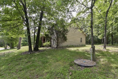 Charming home in this beautiful golf course community. there is on Ledgestone Country Club and Golf Course in Missouri - for sale on GolfHomes.com, golf home, golf lot