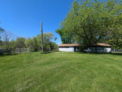 Beautiful acreage set up for horses! This lovely 3 bed, 1.5 bath on Grand Rapids Sparta Moose Golf Course in Michigan - for sale on GolfHomes.com, golf home, golf lot