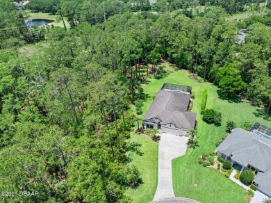 This custom home built 2018 sits on over  3/4  of an acre, in on Plantation Bay Golf and Country Club in Florida - for sale on GolfHomes.com, golf home, golf lot