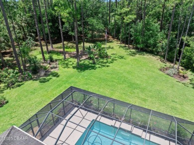 This custom home built 2018 sits on over  3/4  of an acre, in on Plantation Bay Golf and Country Club in Florida - for sale on GolfHomes.com, golf home, golf lot