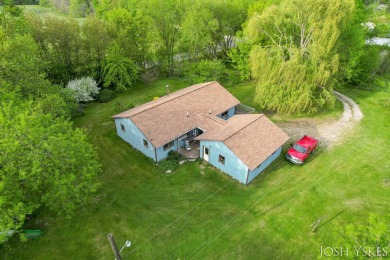 Beautiful acreage set up for horses! This lovely 3 bed, 1.5 bath on Grand Rapids Sparta Moose Golf Course in Michigan - for sale on GolfHomes.com, golf home, golf lot