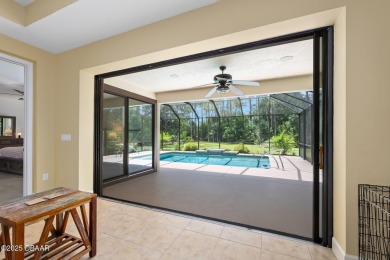 This custom home built 2018 sits on over  3/4  of an acre, in on Plantation Bay Golf and Country Club in Florida - for sale on GolfHomes.com, golf home, golf lot