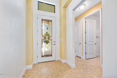 This custom home built 2018 sits on over  3/4  of an acre, in on Plantation Bay Golf and Country Club in Florida - for sale on GolfHomes.com, golf home, golf lot