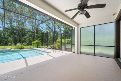This custom home built 2018 sits on over  3/4  of an acre, in on Plantation Bay Golf and Country Club in Florida - for sale on GolfHomes.com, golf home, golf lot