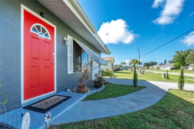 Absolutely Charming home nestled on a large fenced yard along a on Port Charlotte Golf Club in Florida - for sale on GolfHomes.com, golf home, golf lot