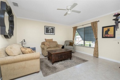 Absolutely Charming home nestled on a large fenced yard along a on Port Charlotte Golf Club in Florida - for sale on GolfHomes.com, golf home, golf lot
