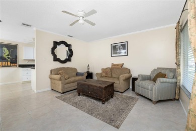 Absolutely Charming home nestled on a large fenced yard along a on Port Charlotte Golf Club in Florida - for sale on GolfHomes.com, golf home, golf lot