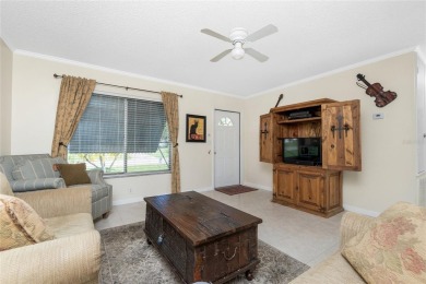 Absolutely Charming home nestled on a large fenced yard along a on Port Charlotte Golf Club in Florida - for sale on GolfHomes.com, golf home, golf lot