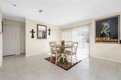 Absolutely Charming home nestled on a large fenced yard along a on Port Charlotte Golf Club in Florida - for sale on GolfHomes.com, golf home, golf lot