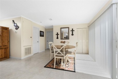 Absolutely Charming home nestled on a large fenced yard along a on Port Charlotte Golf Club in Florida - for sale on GolfHomes.com, golf home, golf lot