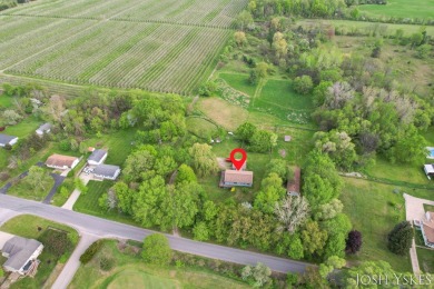 Beautiful acreage set up for horses! This lovely 3 bed, 1.5 bath on Grand Rapids Sparta Moose Golf Course in Michigan - for sale on GolfHomes.com, golf home, golf lot