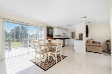 Absolutely Charming home nestled on a large fenced yard along a on Port Charlotte Golf Club in Florida - for sale on GolfHomes.com, golf home, golf lot