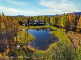 This 5,722 square-foot home features views of the Grand Teton on Teton Pines Golf Club in Wyoming - for sale on GolfHomes.com, golf home, golf lot