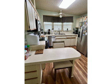 2 Bedroom | 2 Bath | 1,296 sq ft in highly sought after 55+ on Lake Henry Golf Club in Florida - for sale on GolfHomes.com, golf home, golf lot