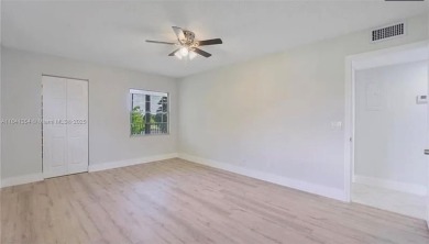Buyer fell through--this beautifully updated corner unit is on Flamingo Lakes Country Club in Florida - for sale on GolfHomes.com, golf home, golf lot