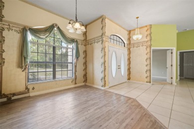 Built by Lindhorst, this warm and welcoming pool home is on Sugarmill Woods Golf and Country Club in Florida - for sale on GolfHomes.com, golf home, golf lot