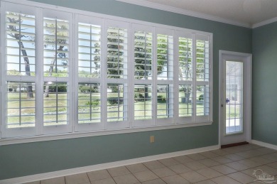 Stunning waterfront stucco home features three bedrooms, two on Tiger Point Golf and Country Club in Florida - for sale on GolfHomes.com, golf home, golf lot