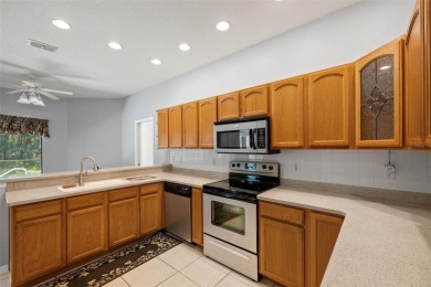 Built by Lindhorst, this warm and welcoming pool home is on Sugarmill Woods Golf and Country Club in Florida - for sale on GolfHomes.com, golf home, golf lot