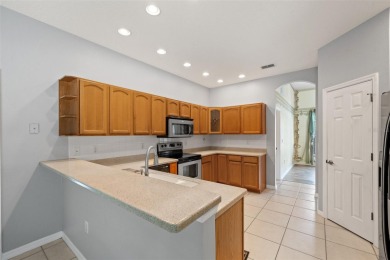 Built by Lindhorst, this warm and welcoming pool home is on Sugarmill Woods Golf and Country Club in Florida - for sale on GolfHomes.com, golf home, golf lot