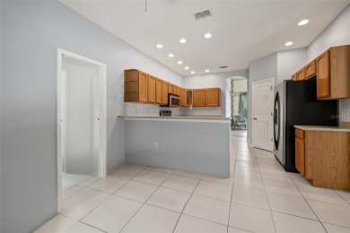 Built by Lindhorst, this warm and welcoming pool home is on Sugarmill Woods Golf and Country Club in Florida - for sale on GolfHomes.com, golf home, golf lot
