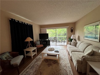 OWNER FINANCING! Active 55+ condo community with 18-27 hole golf on The American Golf Club in Florida - for sale on GolfHomes.com, golf home, golf lot