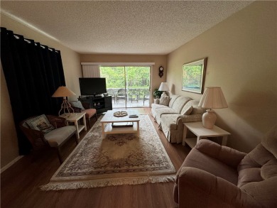 OWNER FINANCING! Active 55+ condo community with 18-27 hole golf on The American Golf Club in Florida - for sale on GolfHomes.com, golf home, golf lot