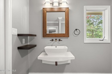 Welcome to 104 Lantern Lane: Discover this stunning home nestled on River Bend Golf and Country Club in North Carolina - for sale on GolfHomes.com, golf home, golf lot