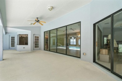 Built by Lindhorst, this warm and welcoming pool home is on Sugarmill Woods Golf and Country Club in Florida - for sale on GolfHomes.com, golf home, golf lot