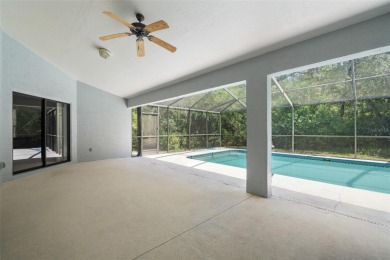 Built by Lindhorst, this warm and welcoming pool home is on Sugarmill Woods Golf and Country Club in Florida - for sale on GolfHomes.com, golf home, golf lot