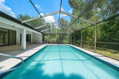 Built by Lindhorst, this warm and welcoming pool home is on Sugarmill Woods Golf and Country Club in Florida - for sale on GolfHomes.com, golf home, golf lot