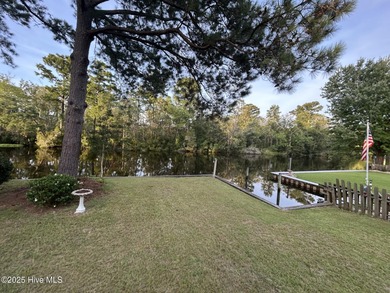 Welcome to 104 Lantern Lane: Discover this stunning home nestled on River Bend Golf and Country Club in North Carolina - for sale on GolfHomes.com, golf home, golf lot
