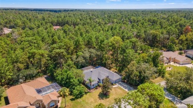 Built by Lindhorst, this warm and welcoming pool home is on Sugarmill Woods Golf and Country Club in Florida - for sale on GolfHomes.com, golf home, golf lot
