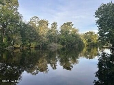Welcome to 104 Lantern Lane: Discover this stunning home nestled on River Bend Golf and Country Club in North Carolina - for sale on GolfHomes.com, golf home, golf lot