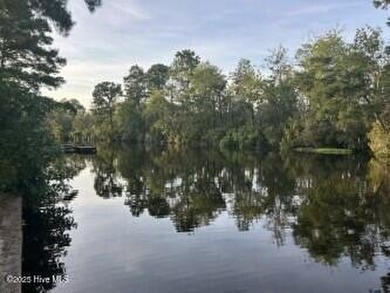 Welcome to 104 Lantern Lane: Discover this stunning home nestled on River Bend Golf and Country Club in North Carolina - for sale on GolfHomes.com, golf home, golf lot