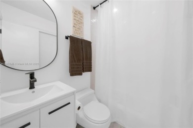 Casa Delfin is a move-in ready dream home, currently configured on Deering Bay Yacht and Country Club in Florida - for sale on GolfHomes.com, golf home, golf lot