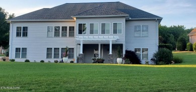 Beautifully remodeled four-bedroom home with a three-car garage on Tellico Village -The Links At Kahite Golf Course in Tennessee - for sale on GolfHomes.com, golf home, golf lot