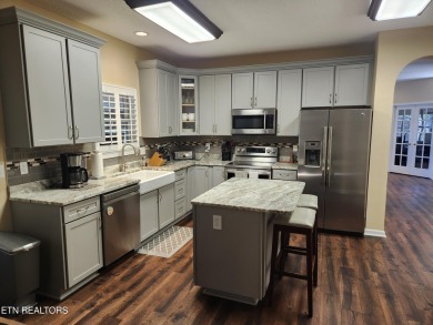 Beautifully remodeled four-bedroom home with a three-car garage on Tellico Village -The Links At Kahite Golf Course in Tennessee - for sale on GolfHomes.com, golf home, golf lot