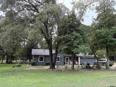 Charming Corner Lot nestled in the serene, gated community of on Holly Lake Ranch Golf Club in Texas - for sale on GolfHomes.com, golf home, golf lot