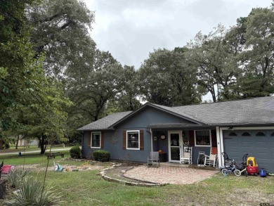 Charming Corner Lot nestled in the serene, gated community of on Holly Lake Ranch Golf Club in Texas - for sale on GolfHomes.com, golf home, golf lot